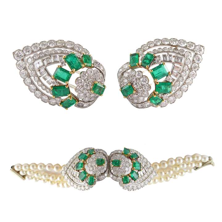 Pair of diamond and emerald palmette double clip brooches forming a bracelet by Cartier, Paris, the clips converting to form the centre of a three row cultured pearl bracelet,